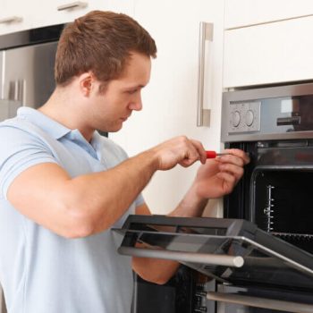 Man Repairing Oven Appliance Service 89119